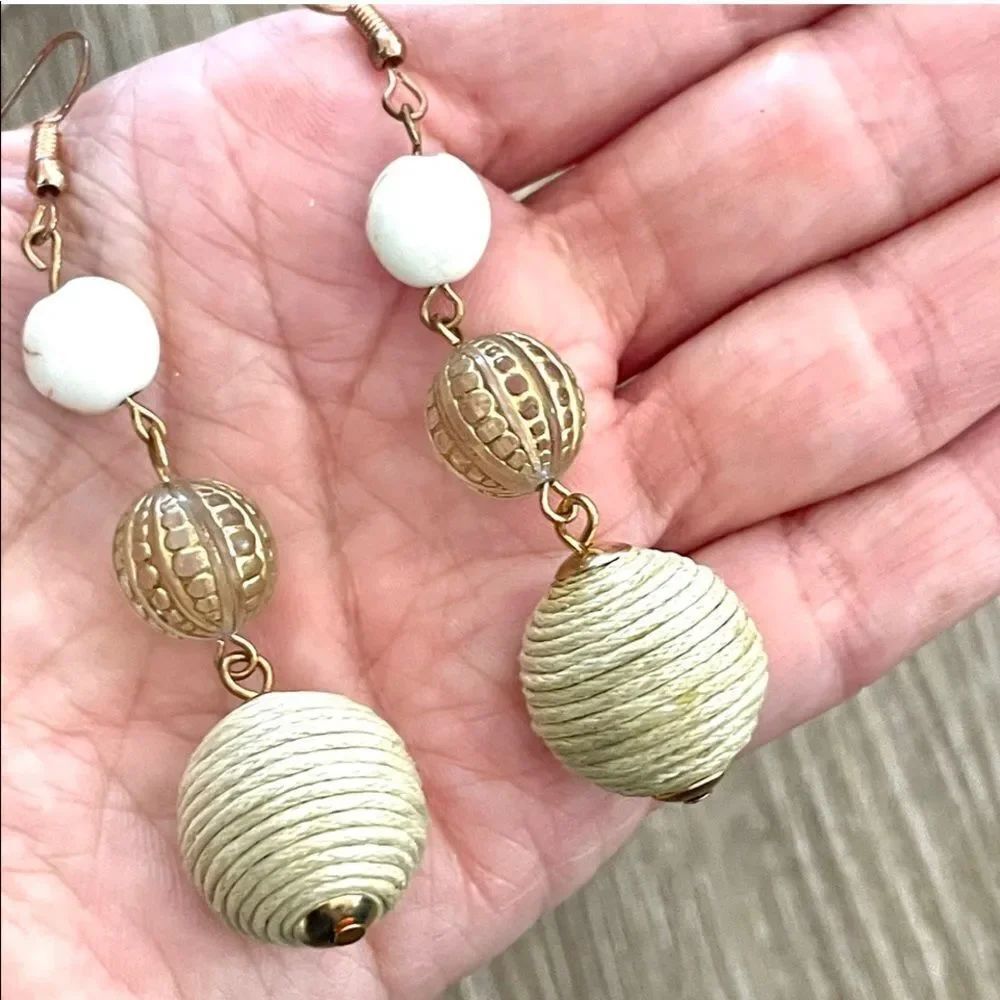 Long neutral toned beaded ball earrings